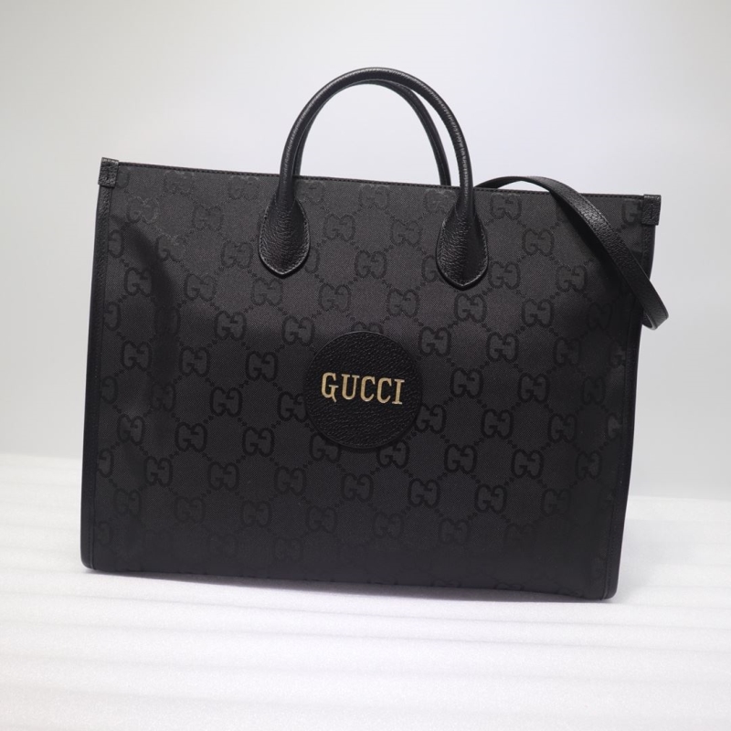 G*u*i shopping bags